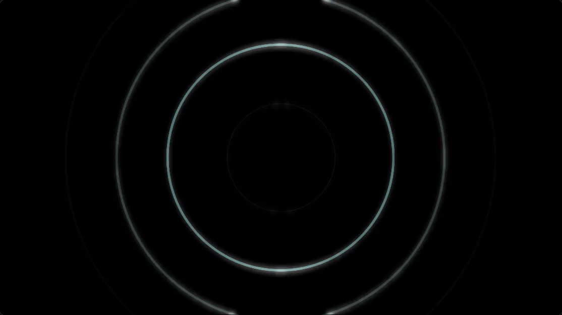 Canvas ahcut saat bagian lagu pelan: beberapa cincin konsentris berwarna hijau kebiruan di atas latar hitam.